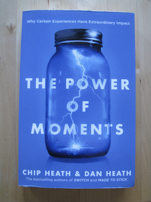 A photos of the book showing a blue cover with a glass jar holding a bolt of lightening