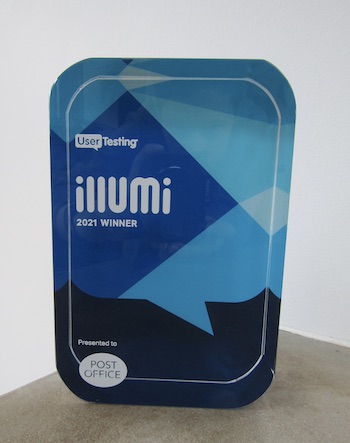 Photo of glass award, says UserTesting illumi 2021 winner.  Presented to Post Office
